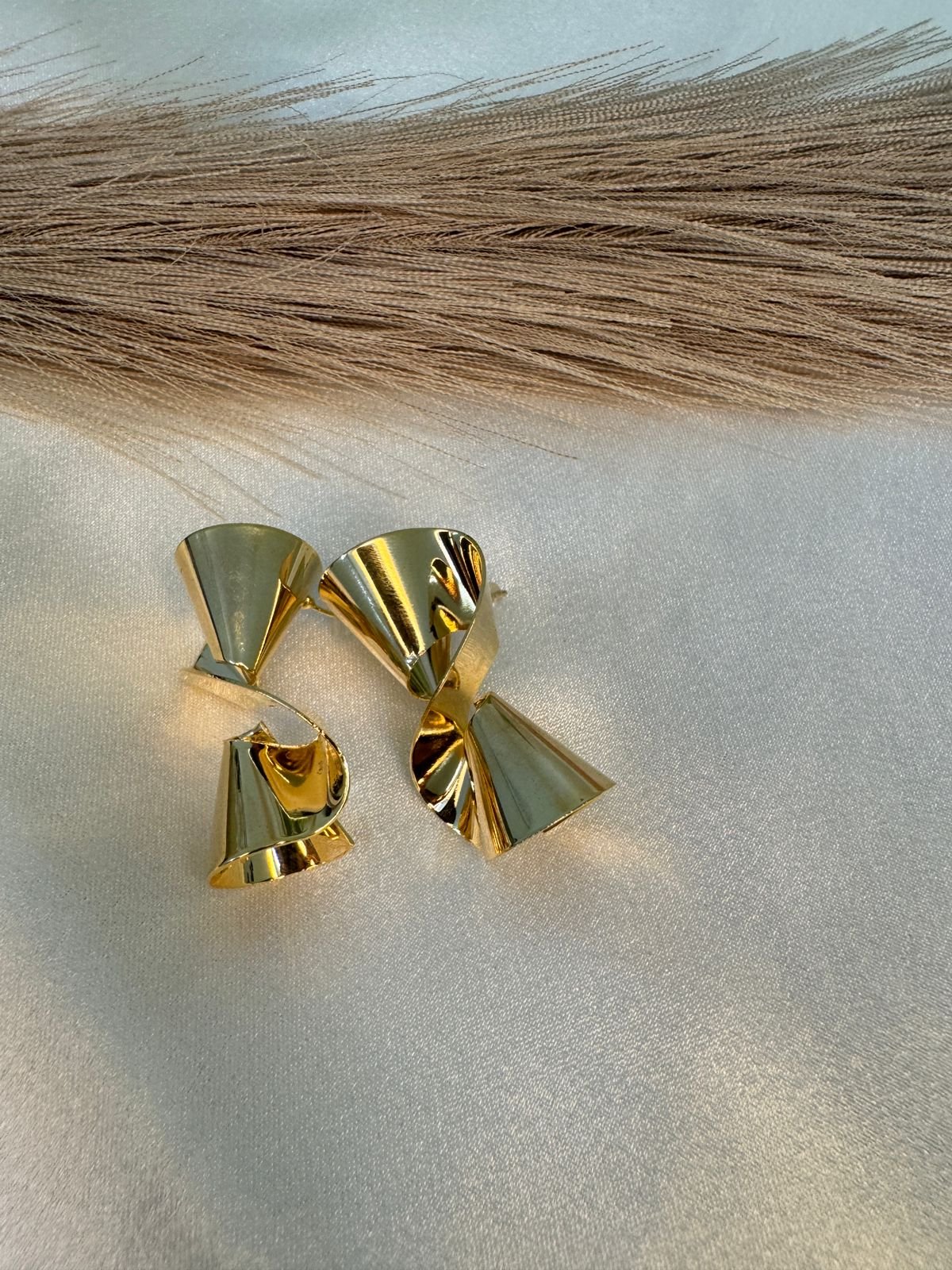 gold-plated unique twisted shape stud earrings.