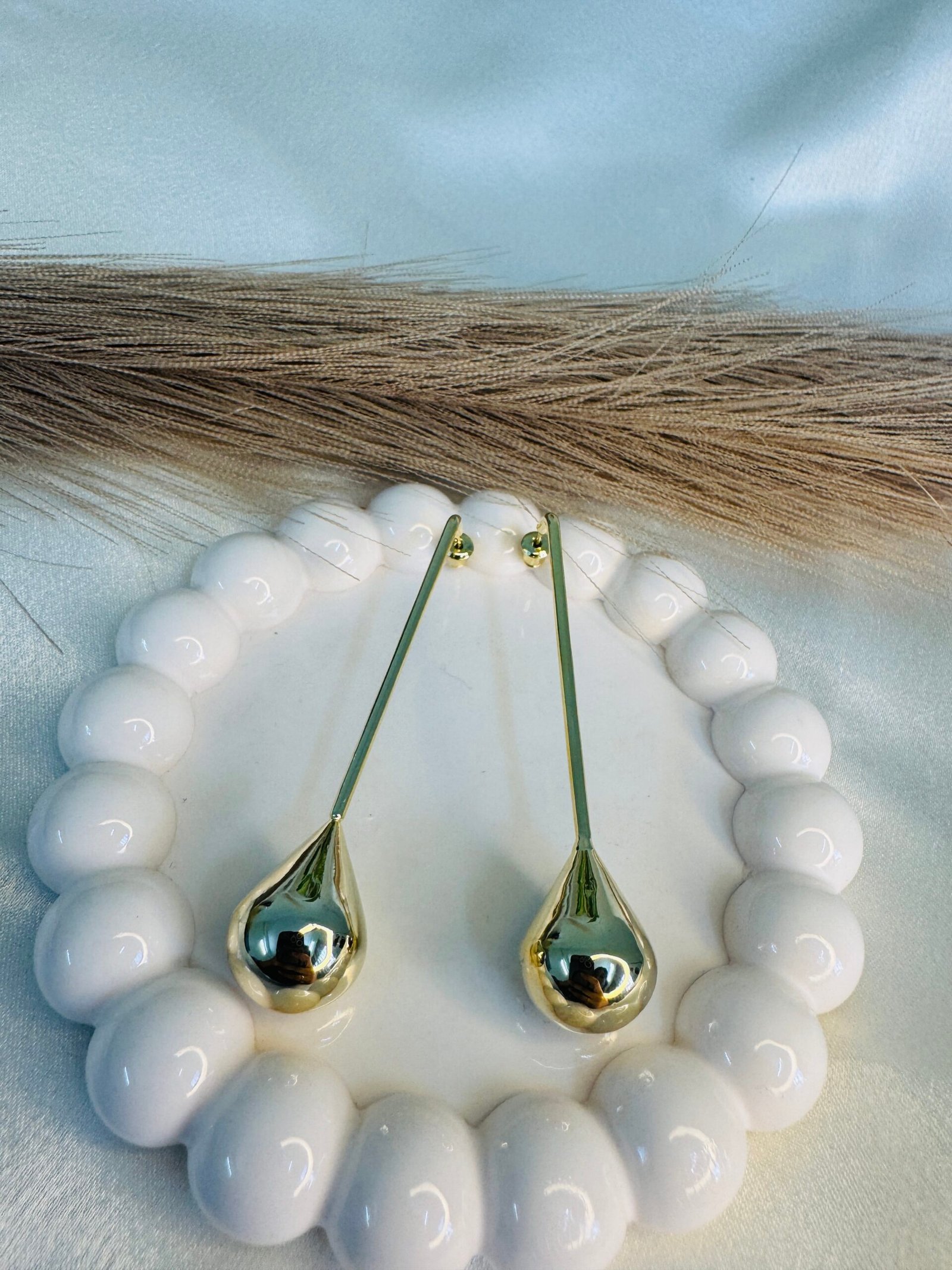 gold-toned Rainula earrings.