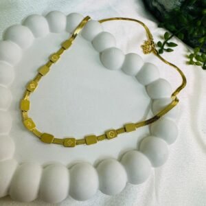 gold-plated-chain-with-square-charms-featuring-a-monogram-pattern