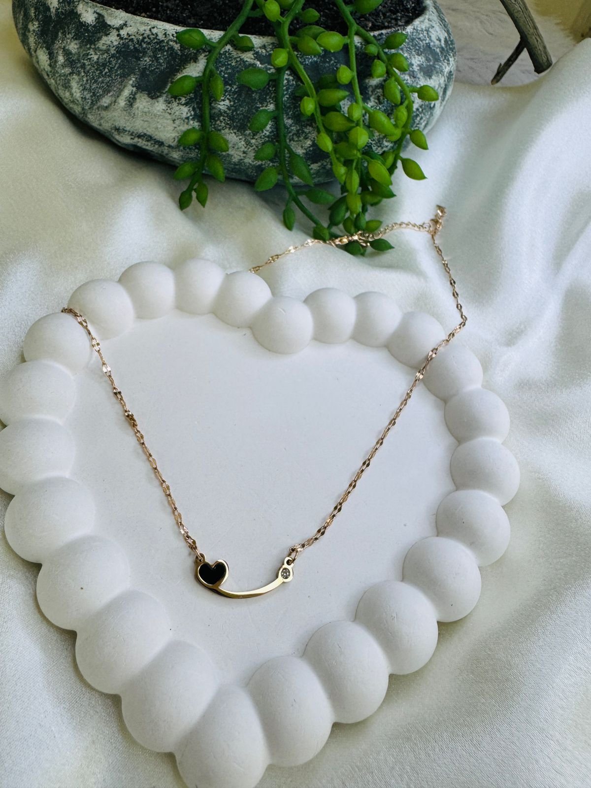 Rose gold-plated stainless steel chain necklace with a black heart pendant and a small cubic zirconia stone. - Image 3