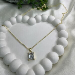 gold-plated-necklace-featuring-a-rectangular-diamond-or-cubic-zirconia-pendant