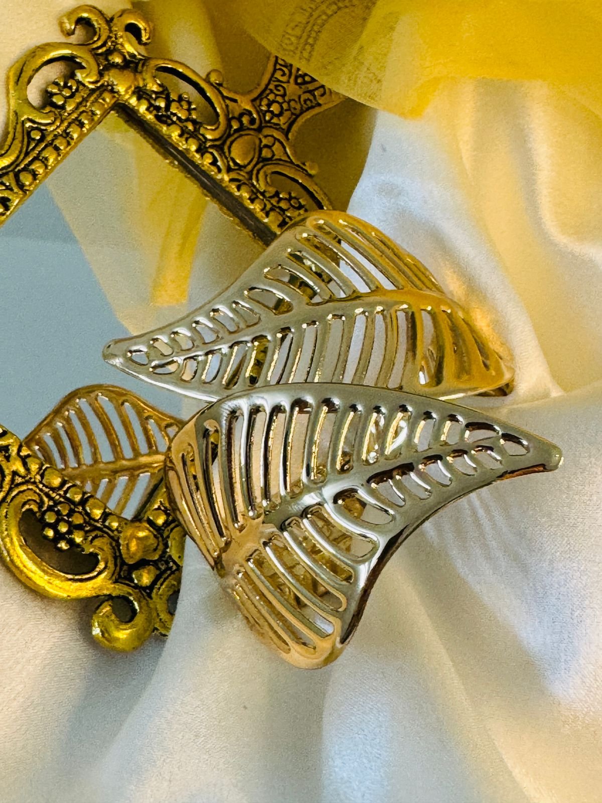 Nature-inspired, high-polish 18K gold-plated leaf cuff bracelet with an open, flexible design. - Image 3