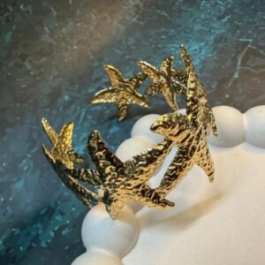 gold-plated-adjustable-cuff-bracelet-with-multiple-starfish-motifs