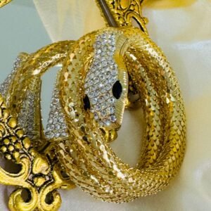Gold-plated rhinestone snake cuff bracelet.