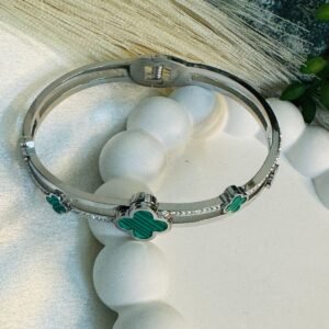 cuff-style-with-hinge-closure-featuring-five-green-clover-shaped-motifs-set-within-the-band