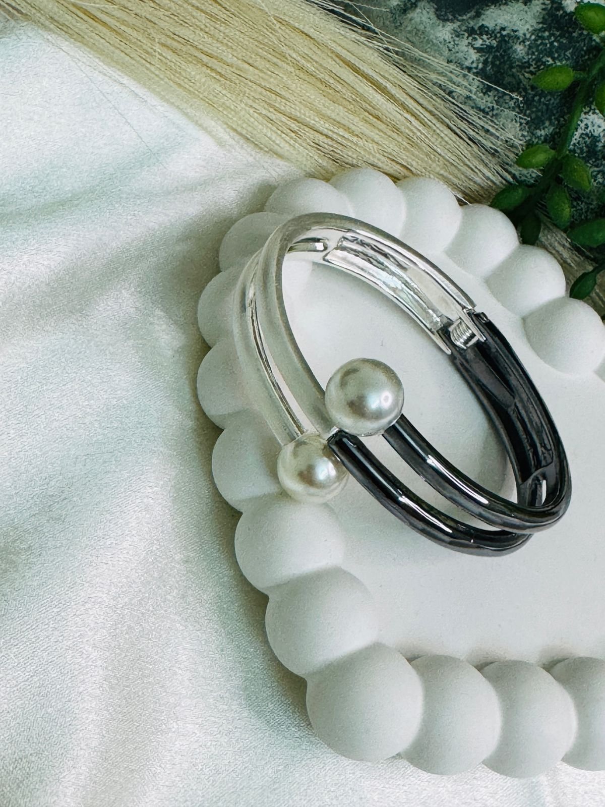 Dual-toned hinged cuff bracelet crafted in metal with faux pearls. - Image 2