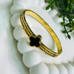 gold-plated-anti-tarnish-bangle-bracelet-featuring-a-black-enamel-four-leaf-clover-charm-and-embedded-zircon-accents
