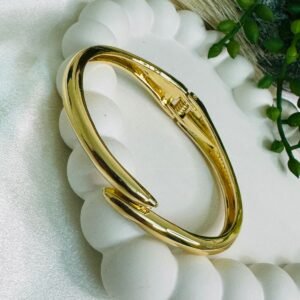 gold-tone-hinged-cuff-bracelet-with-a-modern-sculptural-design